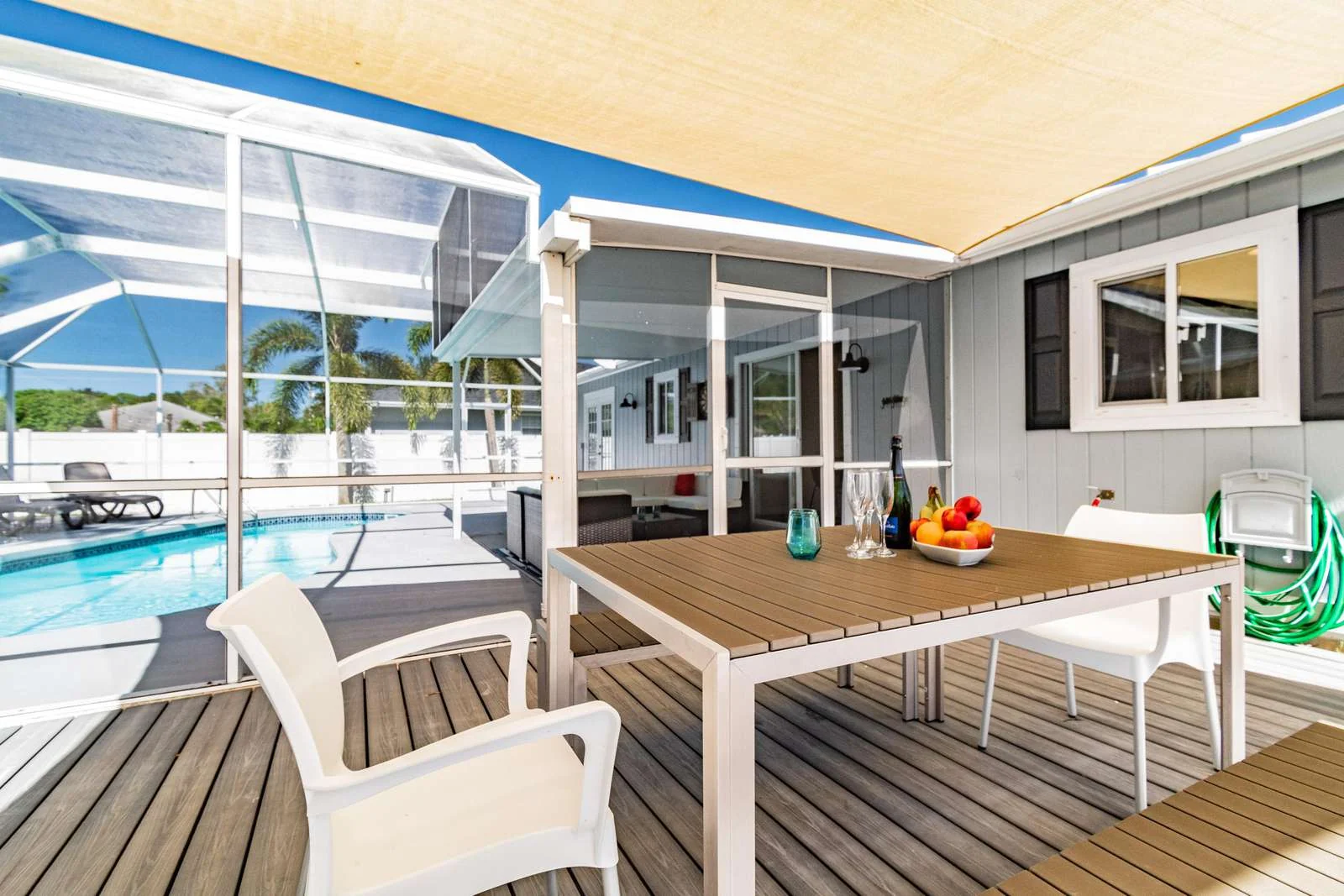Outdoor dining beside pool